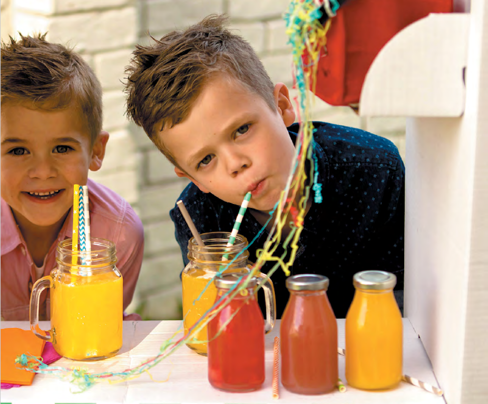 Boys with smoothies and juices at a picnic