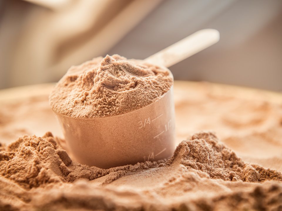 Chocolate protein powder in a scoop
