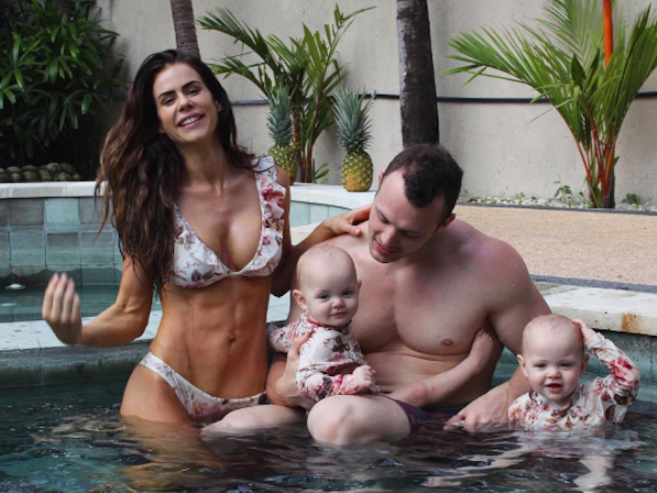 Sophie Guidolin and Nathan Wallace with babies in the spa in Bali