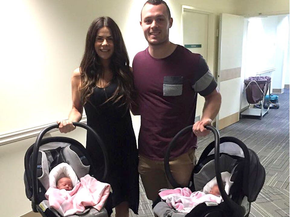 Sophie Guidolin and Nathan Wallace with their babies in carriers|Lots of luggage at the airport